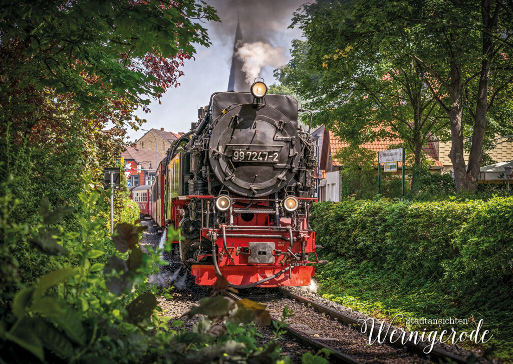 Steam locomotive 99 7247-2 in Wernigerode between green trees